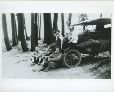 Arnold and Mabel on car with friends.jpg